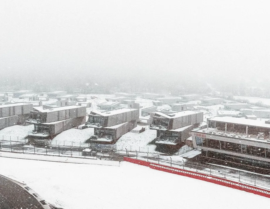snow falling over the escapade estate